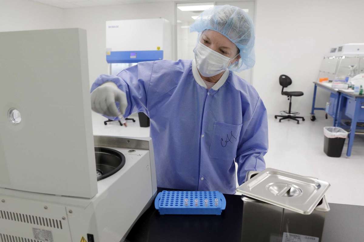 A lab technician analyzing a DNA sample